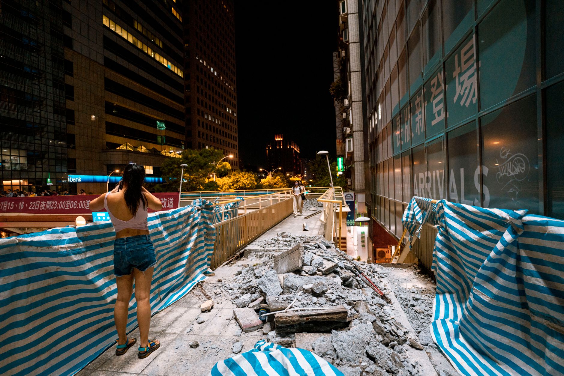 Partially cleared construction site showing debris field and material sorting